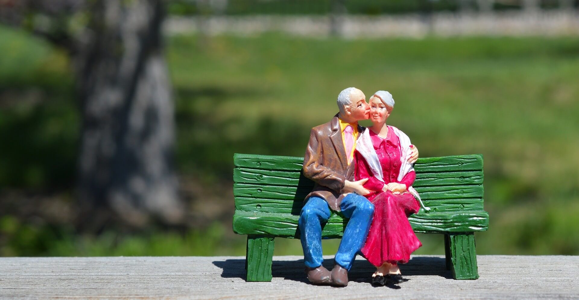 The old couple sitting on the bench
