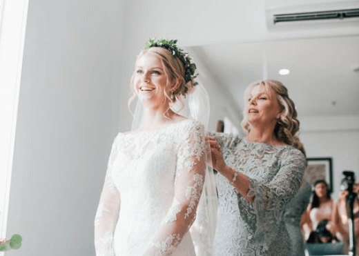 Mother of the Bride Help Her Daughter Wear the Headpiece