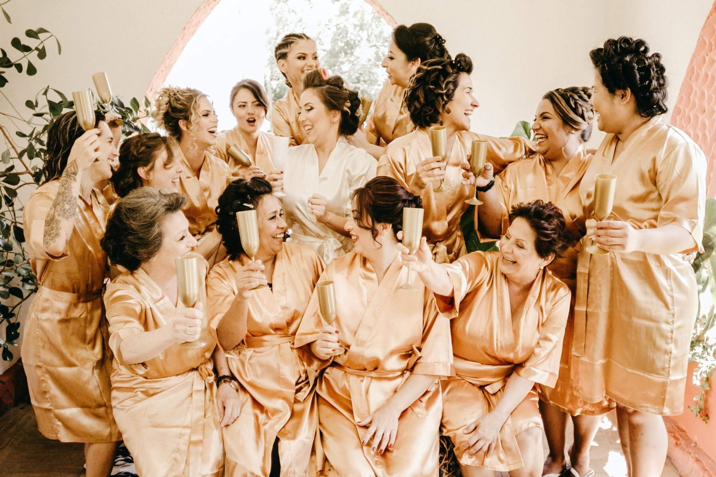 Bridesmaids in their peachy robes
