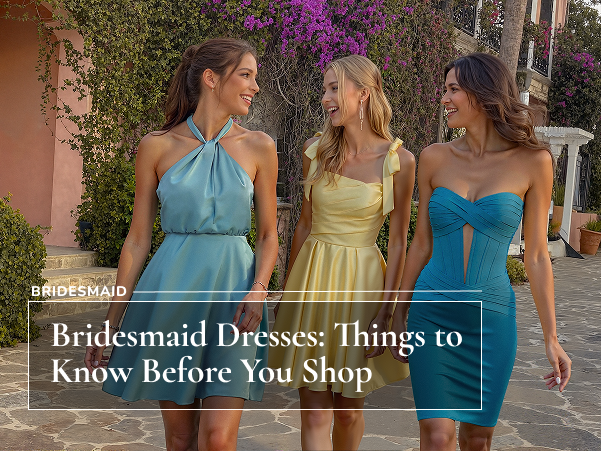 Three ladies in dresses smiling at each other
