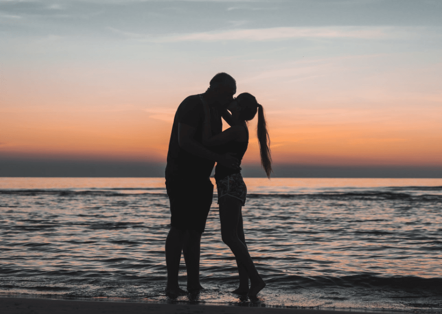 Romantic Kiss beside the Beach at Sunset