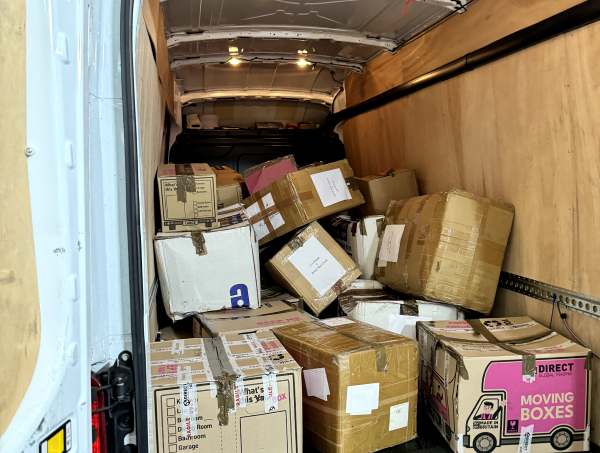 Inner van of The British Red Cross with boxes of donations from JJ's House